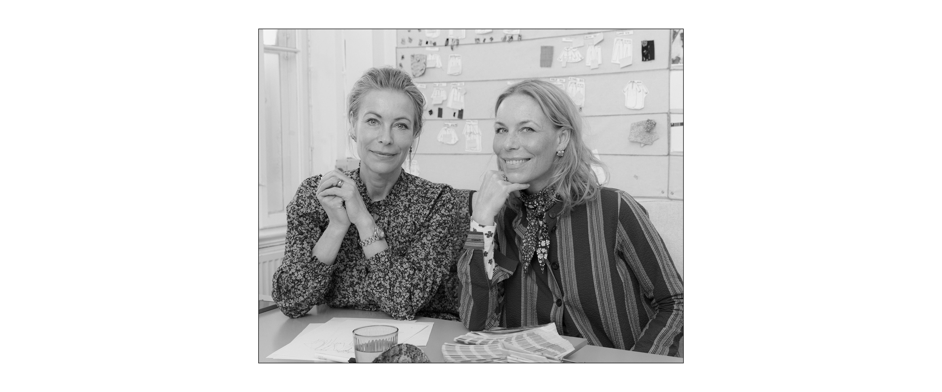 APOF founding sisters Katherine and Frederikke Hviid sitting at desk in their studio