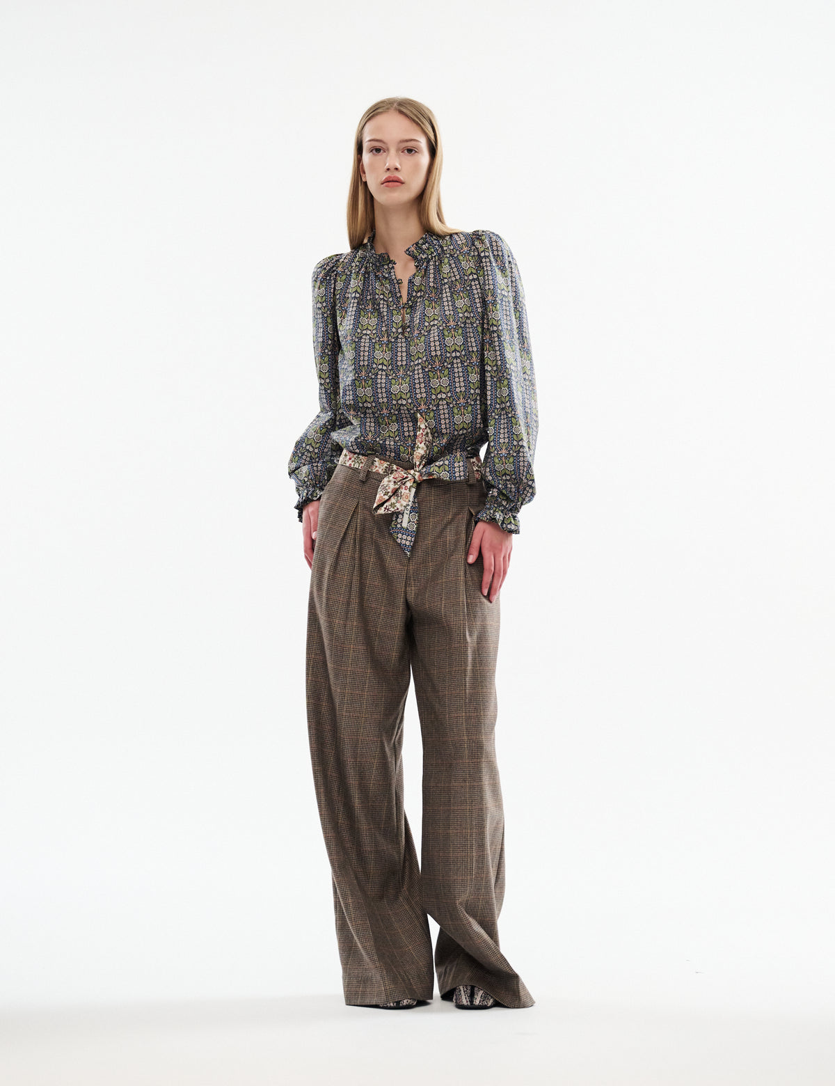 Brown plaid wide-leg pants with side seam crease and long length.
