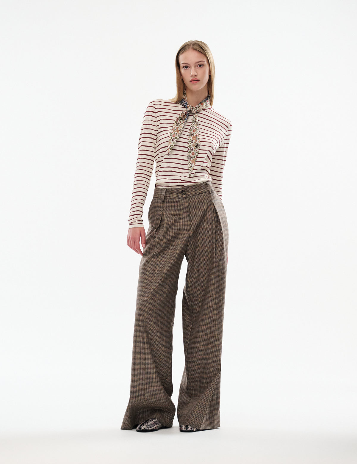 Brown plaid trousers with wide legs, high waist, and straight drape