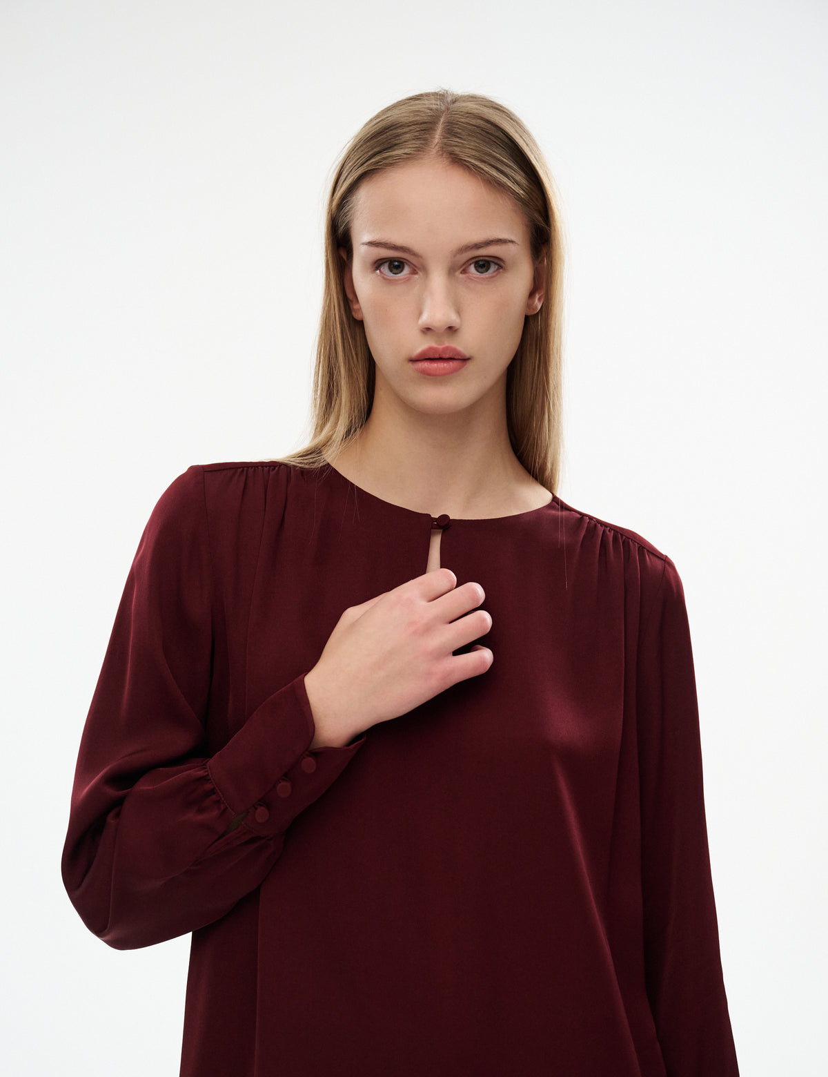 Burgundy midi dress close-up: gathered shoulders, round neckline, button front