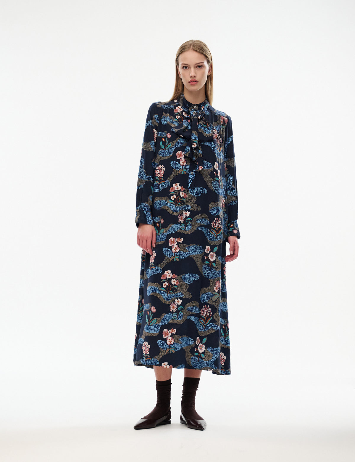Dark navy long-sleeve midi dress with multicolor illustrated print and button front