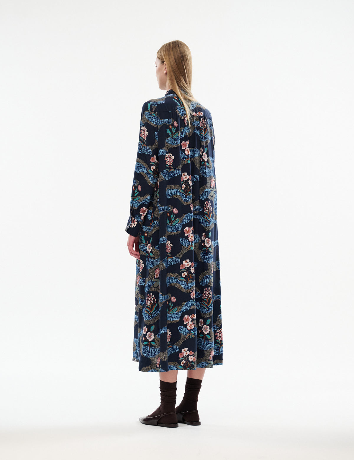 Dark navy long-sleeve midi dress with multicolor illustrated print, back view