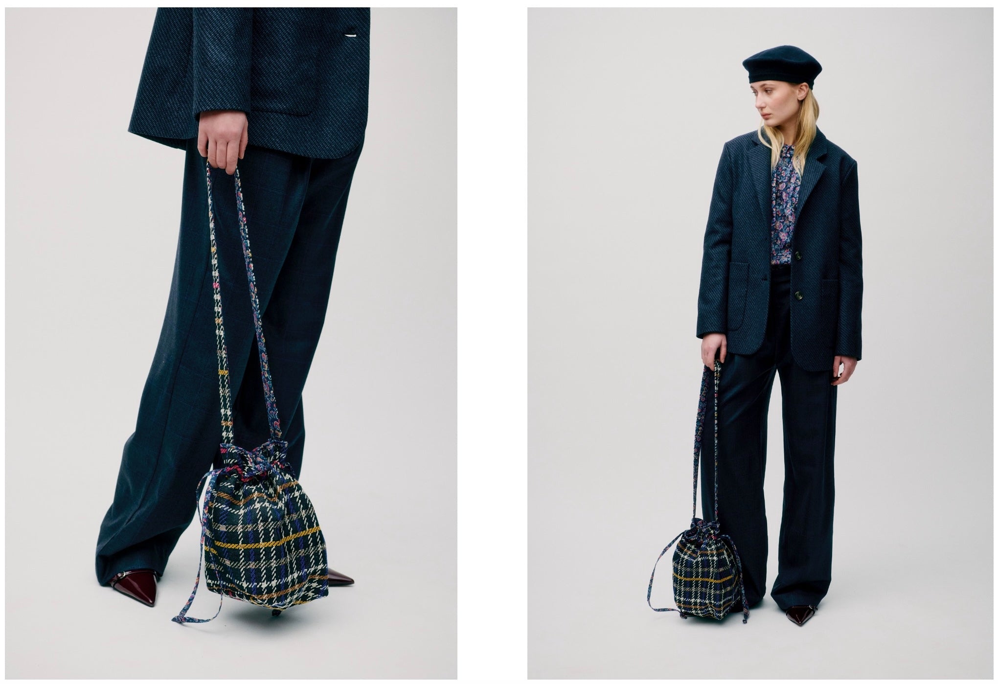 Woman wearing dark blue suits with cross body check print bag 