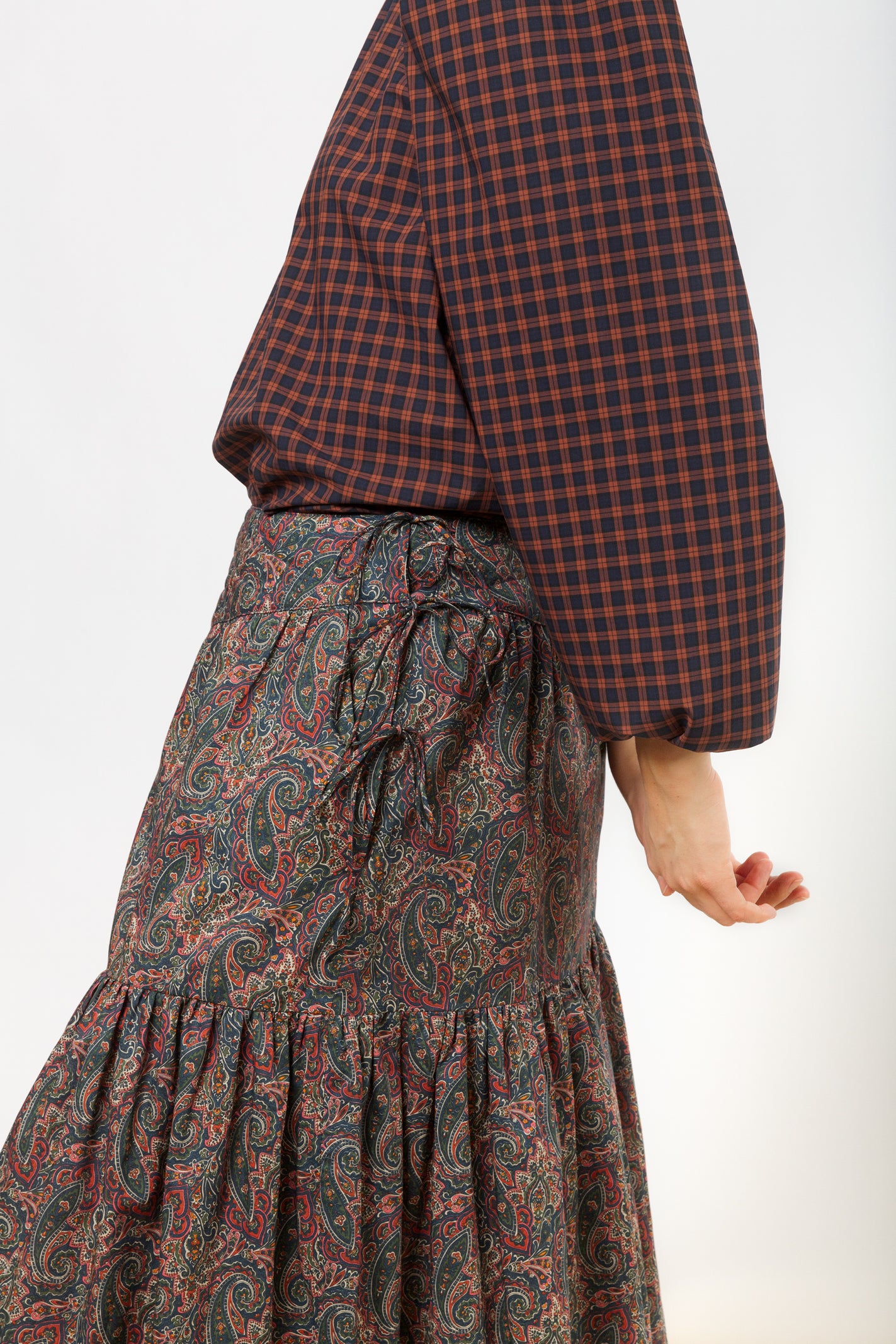 Long multi colored skirt with paisley pattern and checked blouse